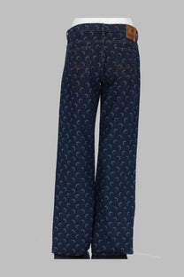 Marine serre women’s dark blue denim jeans with a repeating light gray crescent moon pattern across the fabric
