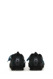 Back view of marine serre women’s ms rise ii black suede sneakers with blue laces and circular logo on heel