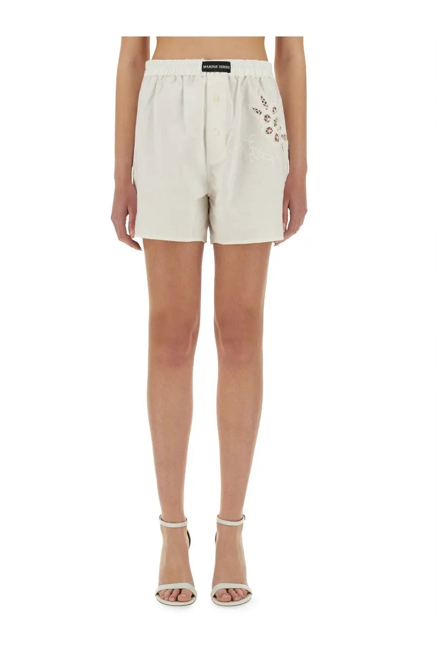 Marine serre women’s upcycled linen shorts in cream with button front and beaded embellishments on the side seam