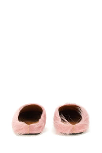 Pink fuzzy slip-on mules made of soft fur-like material shown from back for marni men’s fussbett sabot blue product