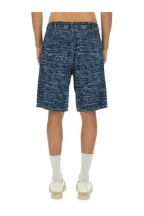 Marni men’s denim blue shorts featuring white graffiti style scribble print on blue denim fabric
