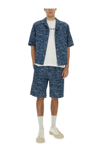 Marni men’s denim blue shorts with white handwritten script pattern on blue denim fabric