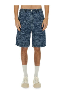Marni men’s denim blue shorts featuring a repeating white mani graffiti style print on soft blue denim