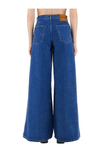 Marni women’s blue denim wide leg jeans showing back with brown leather brand patch at the waistband