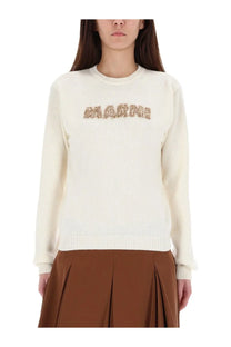 Cream-colored knit sweater by Marni with marine embroidered in textured earth tones on the chest