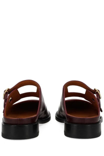 Marni women’s moccasin sabot bambi red burgundy patent leather mules with black rubber soles and gold-tone buckle straps