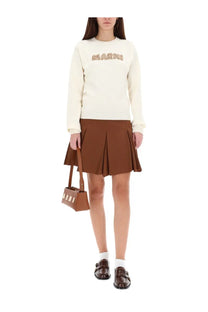 Brown leather mini handbag with white vertical stripes paired with marni womens pleated miniskirt brown