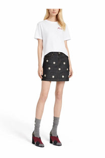Black denim mini skirt with white floral embroidery paired with Marni women’s white shirt front view