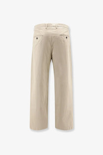 Beige cotton chino trousers with relaxed fit and subtle pleats at the back by Massimo Osti men’s wear