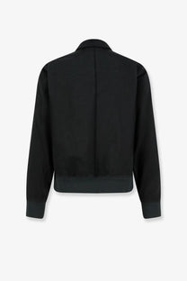 Massimo osti men’s darkshadow black nylon bomber jacket with sleek minimalist design and ribbed cuffs visible from back
