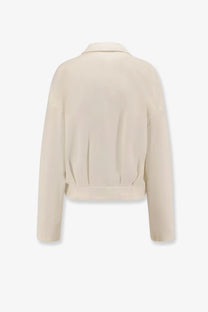 Back view of max mara women’s argenta cream cropped jacket in soft textured silk and cotton fabric with subtle pleats