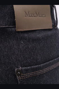 Dark-wash max mara women’s cotton blend trousers with brown leather brand label on waistband back side view