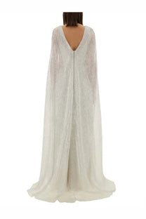 Back view of max mara women’s delta bridal dress white featuring a flowing white lace cape with deep v-back sheer fabric