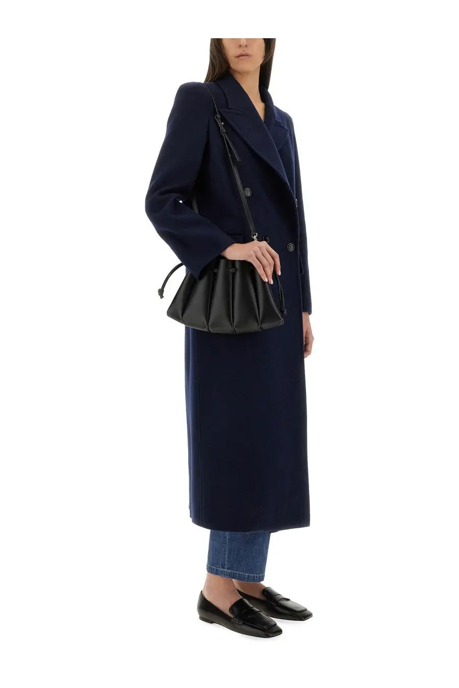 Black leather bucket bag with drawstring closure and structured pleats complementing max mara women’s coat