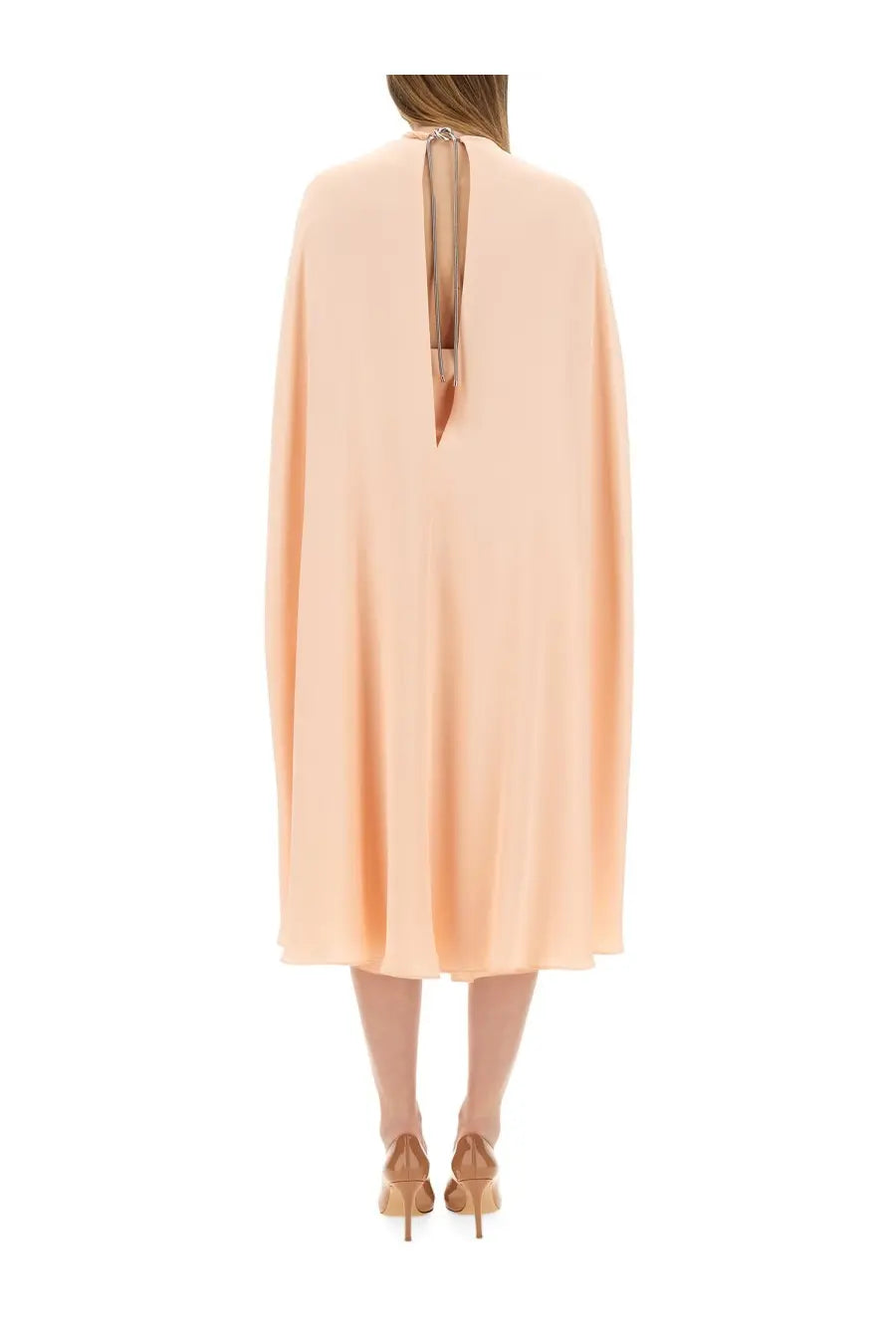 Max mara women’s flowing peach-colored cape dress with back tie detail shown from the back