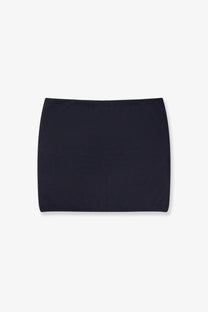 Black minimalist mini skirt with smooth stretchy fabric and clean straight hemline paired with max mara blue cashmere sweater