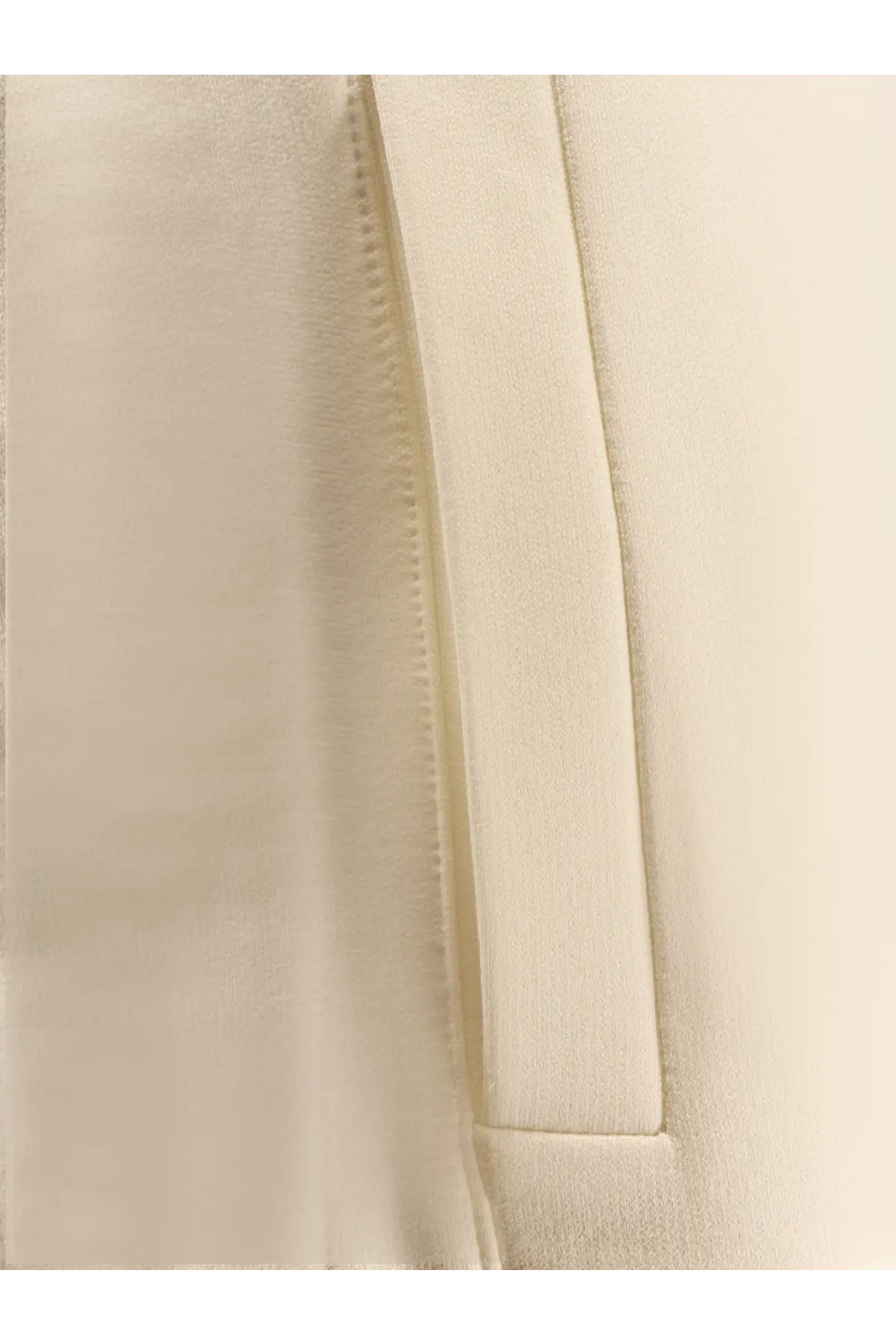 Cream-colored satin fabric with smooth reflective surface and stitching on max mara filovia jogger silk cotton trousers white