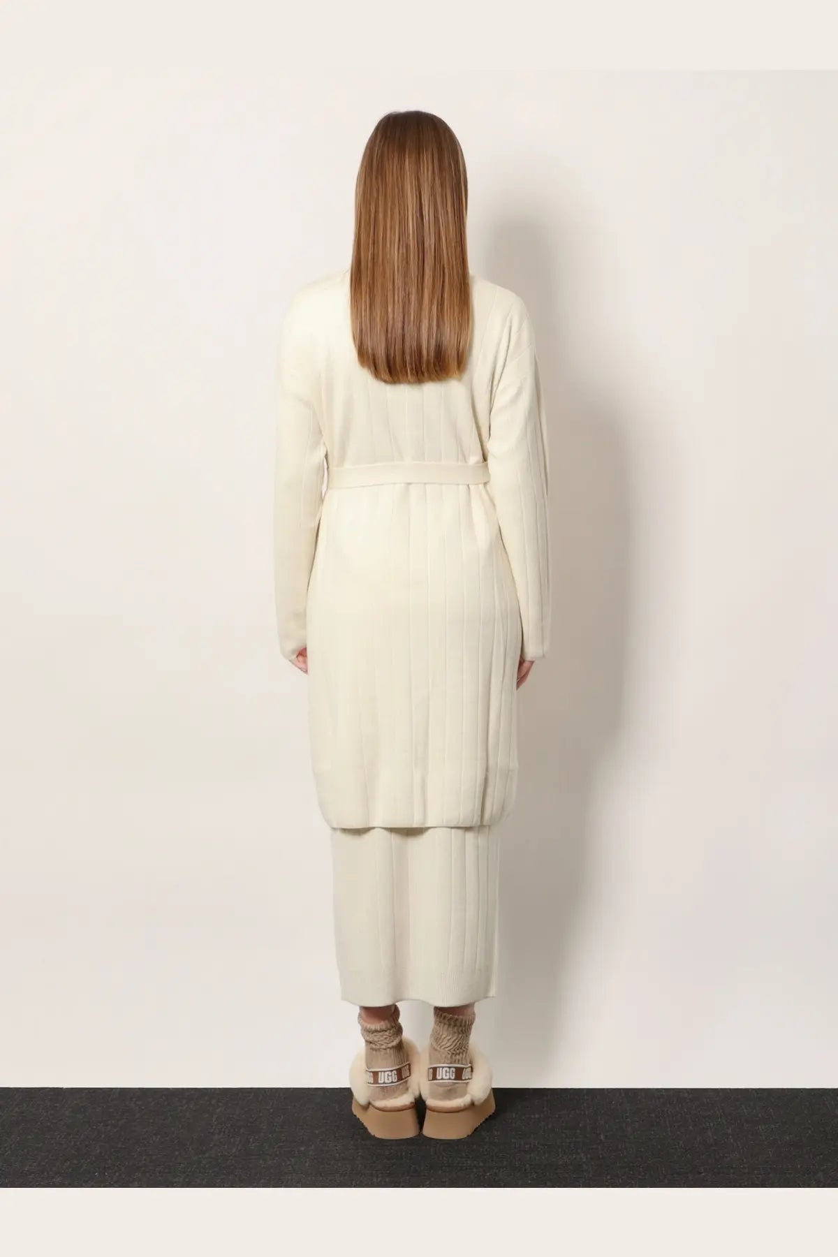 Cream-colored ribbed knit cashmere cardigan and matching wide-leg pants paired with ugg platform boots by max mara