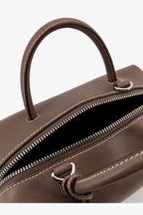 Brown leather Max Mara women’s holdalls handbag with silver-toned zipper and matching stitching in gold accents