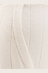 Cream-colored ribbed knit sweater with soft textured fabric and vertical stitching paired with max mara jardin cashmere trousers white