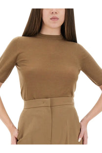 Tan ribbed jersey mock neck top with three quarter sleeves and matching high waisted trousers by max mara