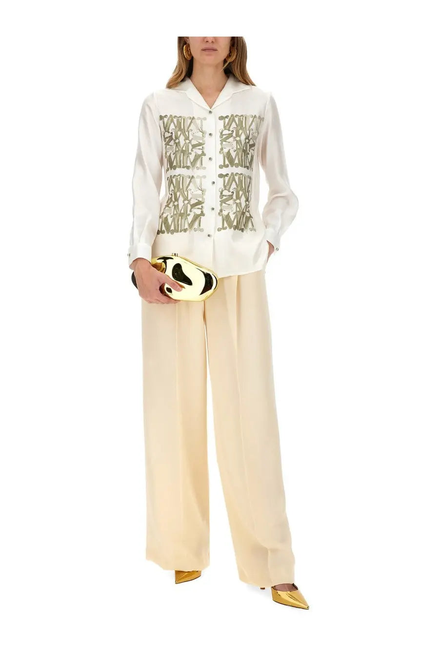 A sleek gold and black panda shaped clutch with a glossy finish paired with max mara women’s klaus beige pants