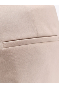 Beige textured fabric blazer with subtle woven pattern and tailored flap pocket paired with max mara green mohair silk trousers