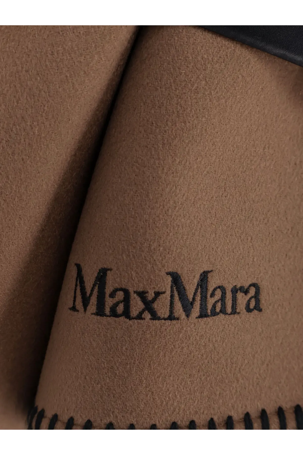 Brown suede fabric with black embroidered maxmara logo and stitched edge on max mara virgin wool cape brown
