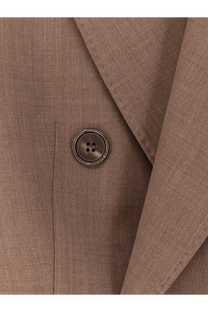 A dark metallic button with four holes on the textured beige virgin wool fabric of max mara mxmcupola blazer