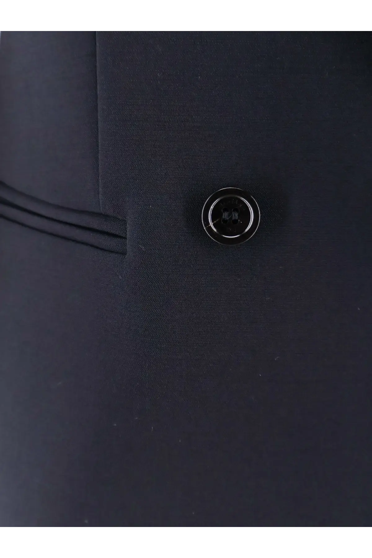 Black button with a glossy finish on max mara women’s mxmdorico stretch virgin wool blue blazer against dark fabric