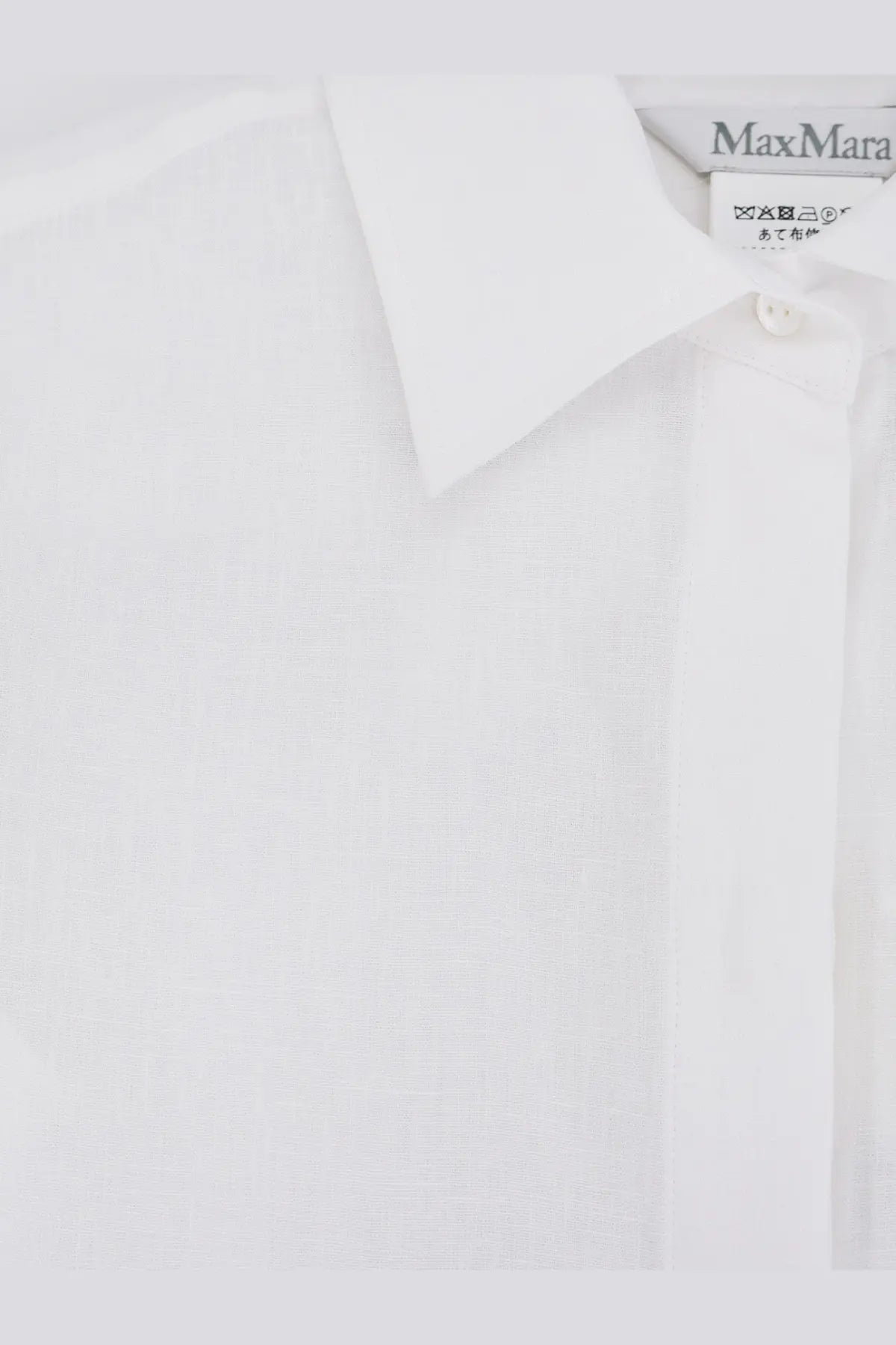 Max Mara women’s white cotton button-down shirt with classic collar and subtle texture featuring brand label