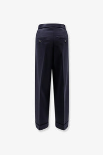 Dark navy wide-leg max mara virgin wool trousers with tailored fit and subtle back pleats shown from the back side