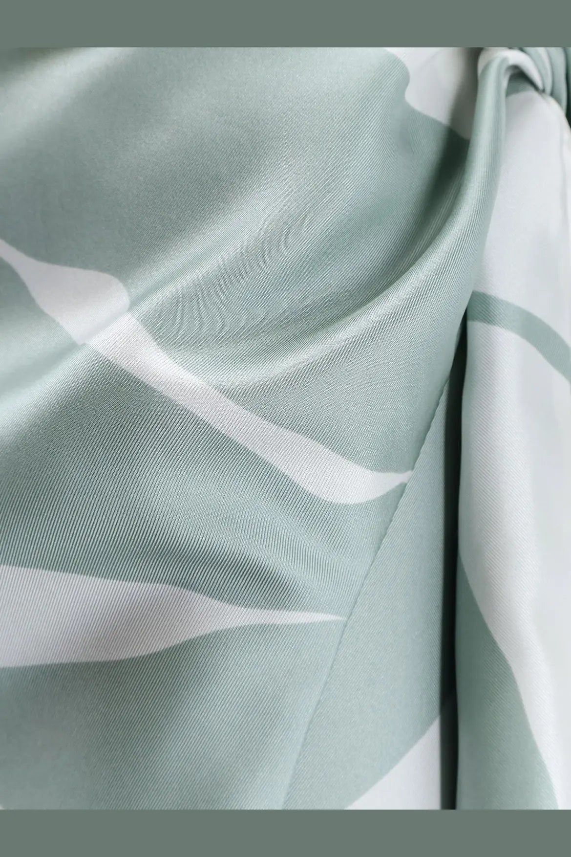 Max Mara women’s mxmstrano silk pareo skirt in soft mint green with flowing white abstract wave patterns