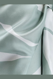Max Mara women’s mxmstrano silk pareo skirt in soft mint green with flowing white abstract wave patterns