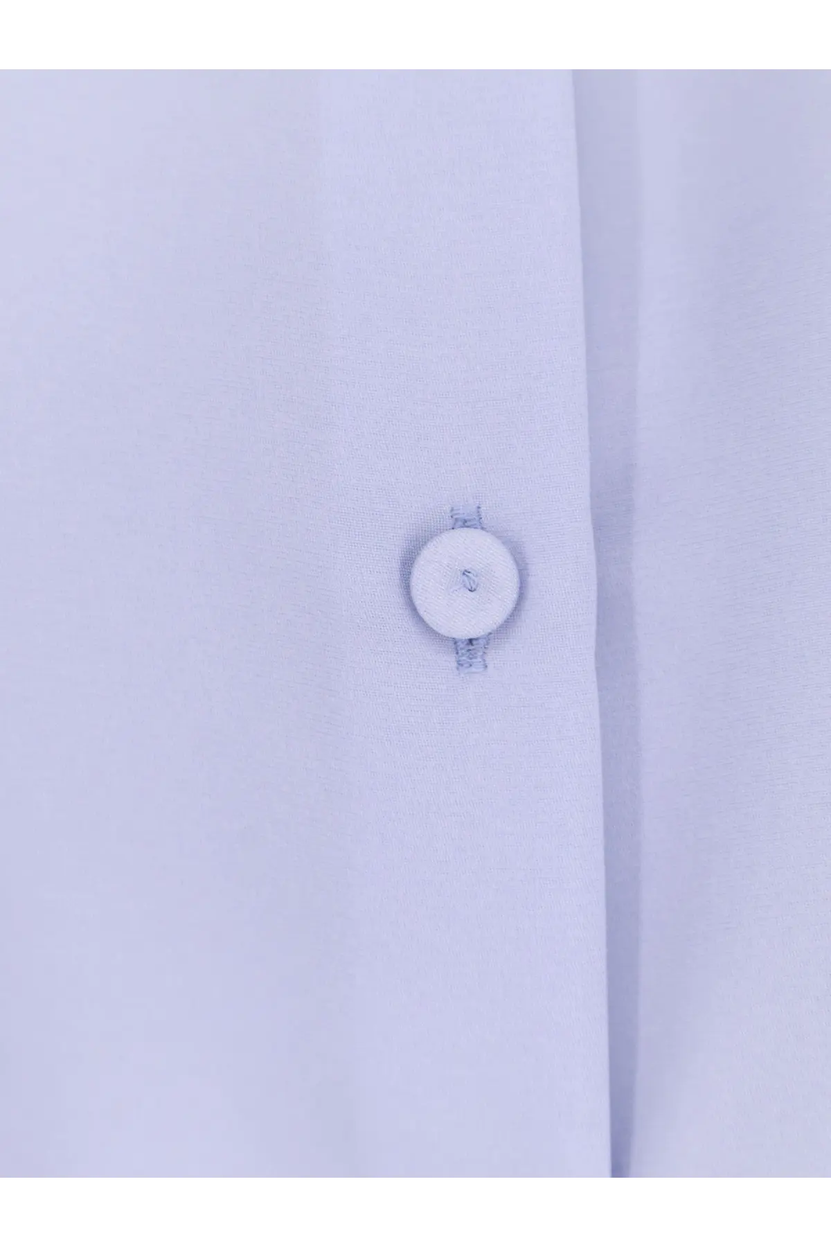 A crisp white button with a subtle texture sewn on light blue silk fabric of max mara mxpvoliera stretch shirt