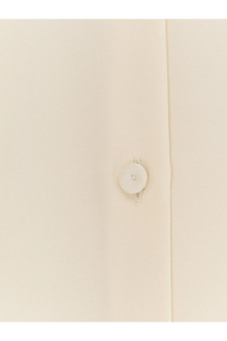 A crisp white button centered on the seam of a max mara womens mxpvoliera stretch silk white dress shirt