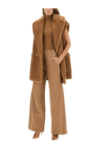 A plush camel-colored shearling vest with soft textured exterior and matching button closure from Max Mara beige pants line