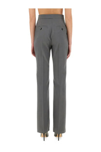 Back view of max mara women’s turdigo grey tailored trousers with straight-leg cut and black button-accented pockets