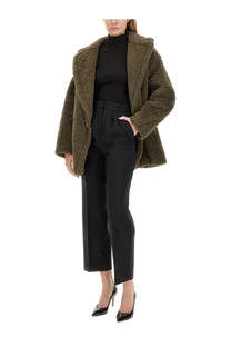 Olive green shearling coat with plush textured exterior and cozy hooded design paired with max mara women’s black verbano pants