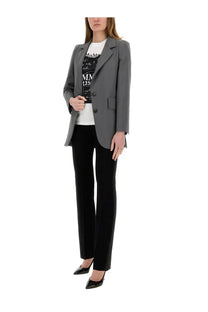Gray tailored blazer with notched lapels and three buttons paired with max mara women’s black pants win