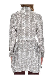 Max Mara women’s printed silk chemisier dress in beige with a gray and white geometric patterned long-sleeved shirt and belted waist