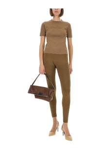 Brown leather clutch with black strap and flap closure paired with max mara women’s shirt adelio beige