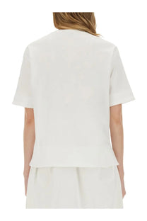 Max Mara women’s white minimalist short-sleeved shirt with tailored fit and subtle peplum hem