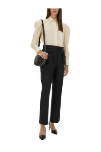 Black leather circular crossbody bag with gold-tone hardware paired with max mara women’s faraday white shirt