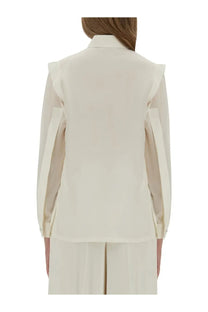 Cream-colored Max Mara women’s silk blazer with sheer ruffled sleeve panels and a structured collar