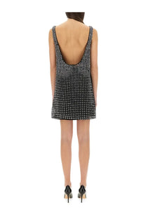 Max mara women’s short black mini dress with silver studs thin straps and deep back cutout shown from back side