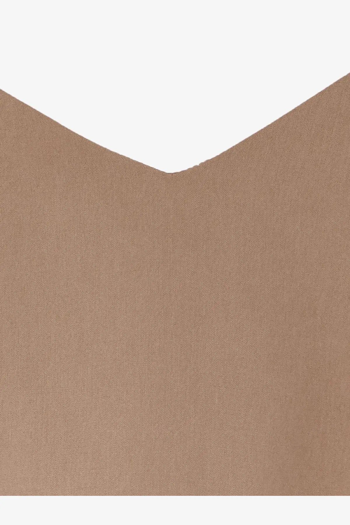 A close-up of tan silk textured fabric with a subtle weave pattern from max mara womens silk munghia top beige