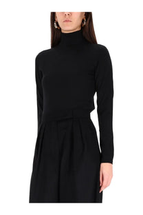 Max mara women’s black knit turtleneck dress with long sleeves cinched waist and pleated skirt
