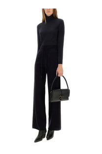 Black leather handbag with distinctive gold-tone clasp and top handle complementing Max Mara Meana blue turtleneck sweater