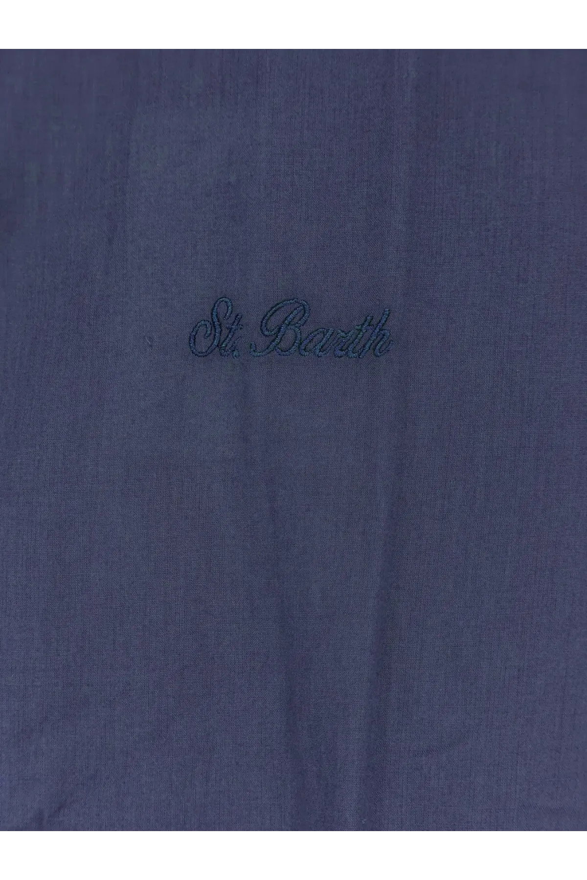 Dark blue linen fabric detail of mc2 saint barth men’s ice cotton shirt with st branding visible